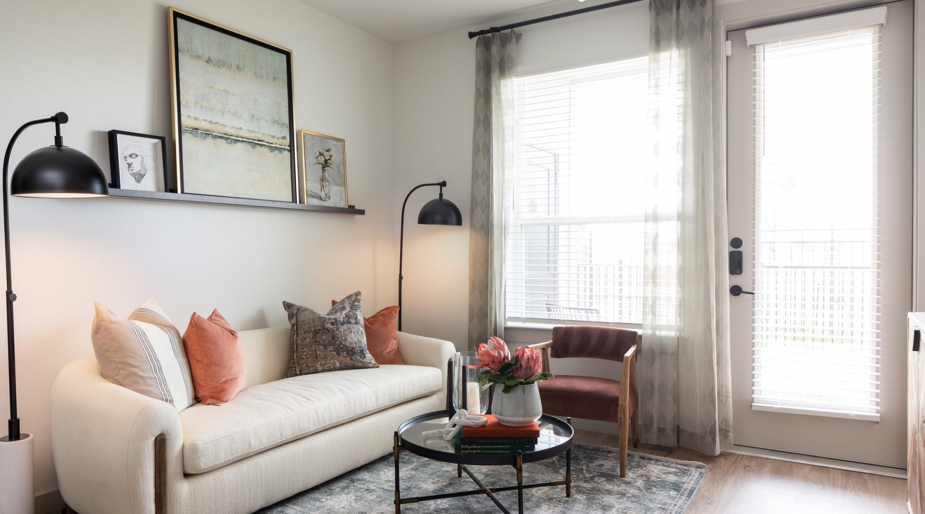 living room with a couch and bright lighting